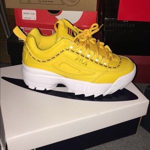 Brand new yellow Filas unworn.